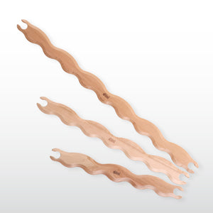 BØLGEFORMEDE VÆVESKYTTER