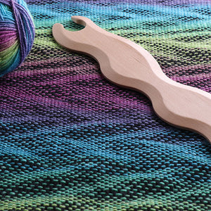 BØLGEFORMEDE VÆVESKYTTER